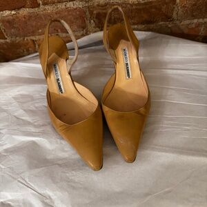 Manolo Blahnik Carolyn kitten heel slingback pumps in a tan/mustard color. Size